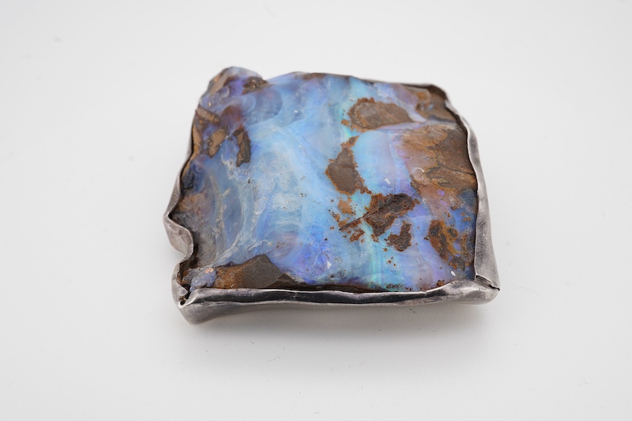 A 925 mounted rough cut opal pendant brooch, 52mm by 47mm. Condition - fair